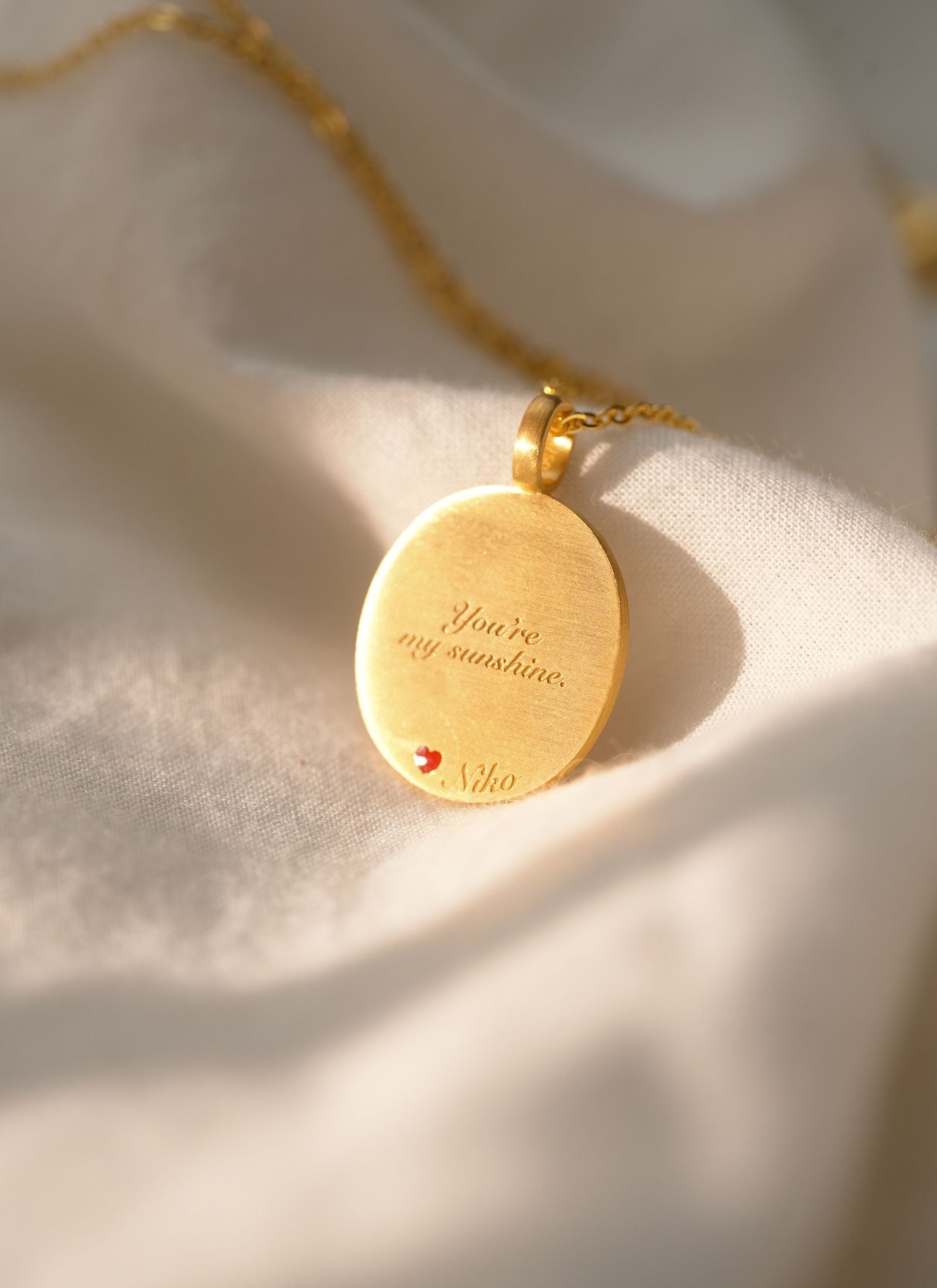 Back view of a pet memorial necklace with custom engraving options for remembrance