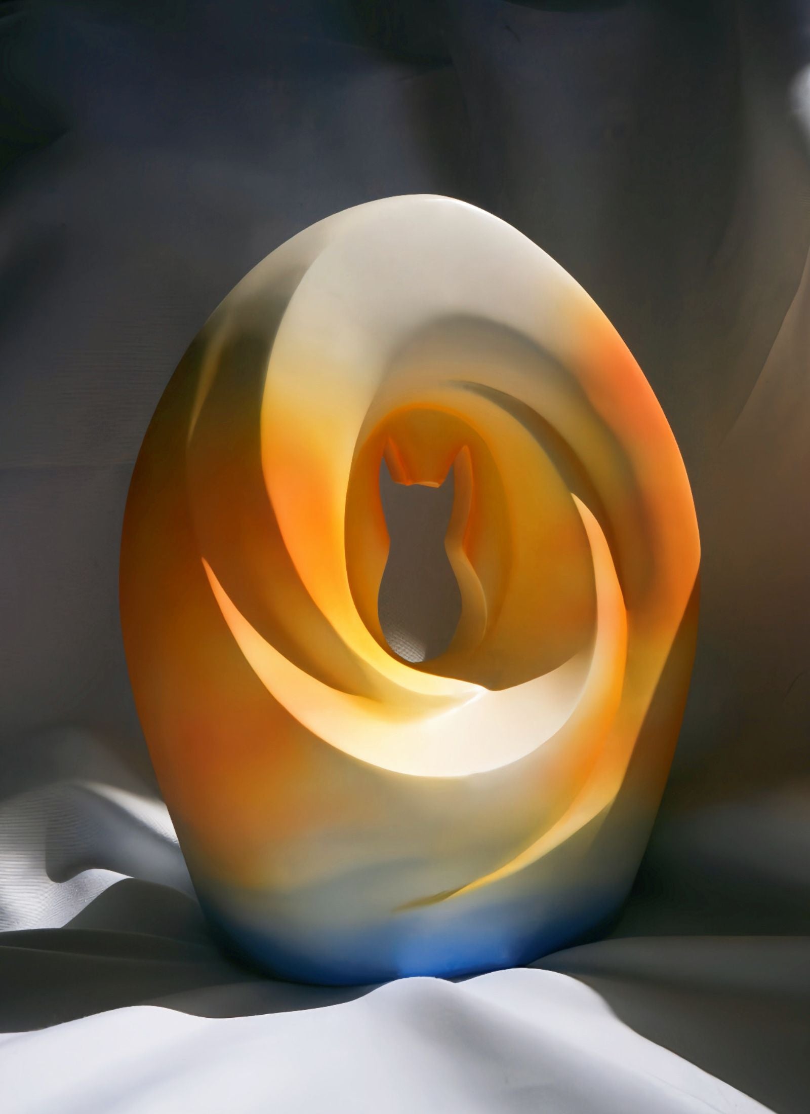 A modern pet urn with a cat silhouette carved into an abstract crescent moon design, featuring smooth curves and warm gradient colors of orange, gold, and blue.