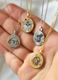 Load image into Gallery viewer, Hand displaying multiple custom pet memorial necklaces with dog and cat portraits
