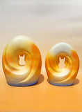 Load image into Gallery viewer, Two sizes of the Sunset Memories Pet Urn with soft, glowing tones representing the transition to a new chapter.
