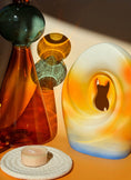Load image into Gallery viewer, Close-up of the Sunset Memories Pet Urn, showcasing warm colors and delicate craftsmanship.

